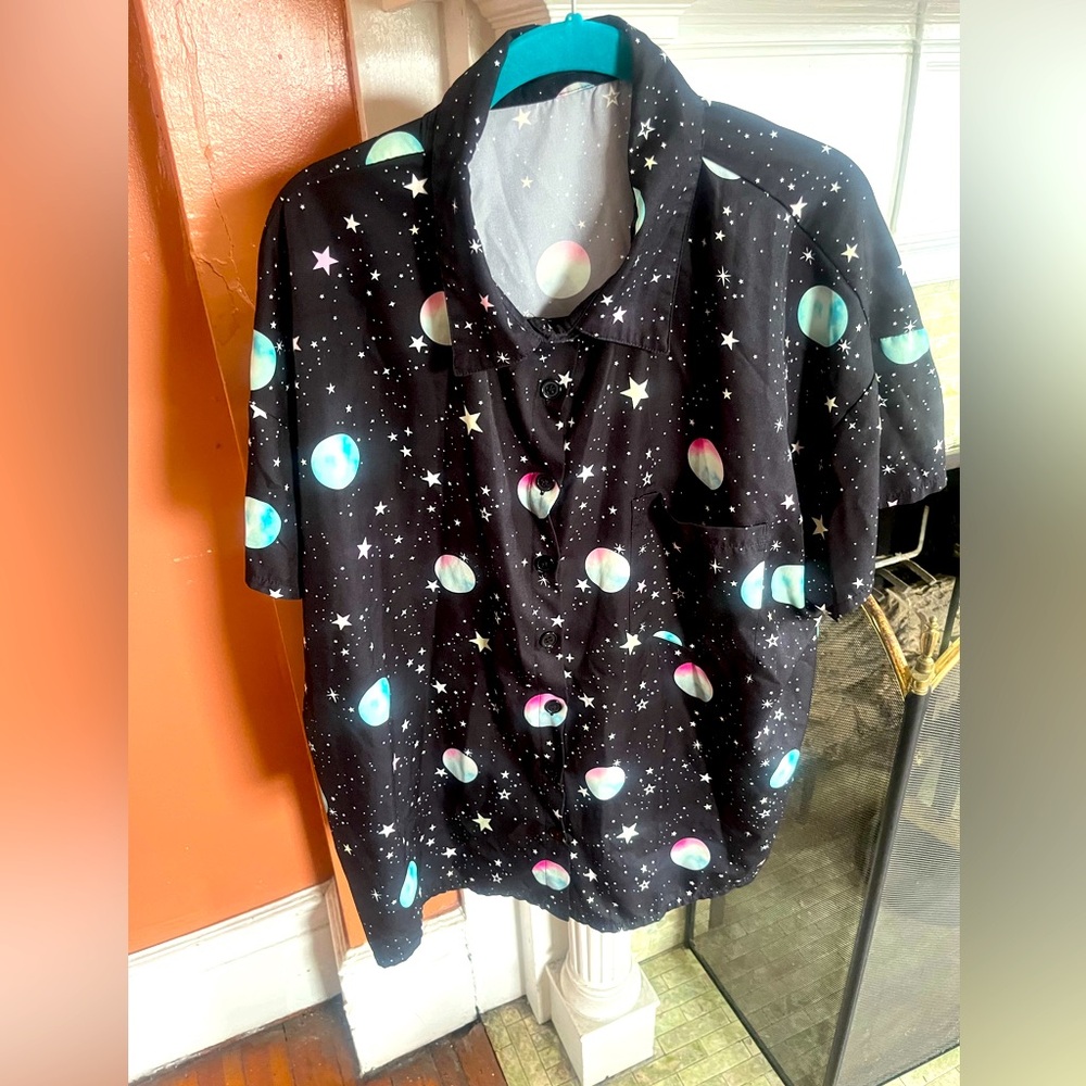 This is a SHEIN black galaxy 🌌 button down shirt 👕